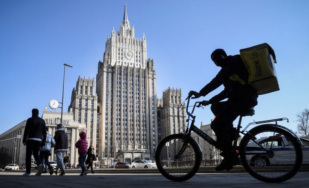 People walk and cycle past the Russian Foreign Ministry building in Moscow on February 22, 2020. u00e2u20acu201dAFP pic