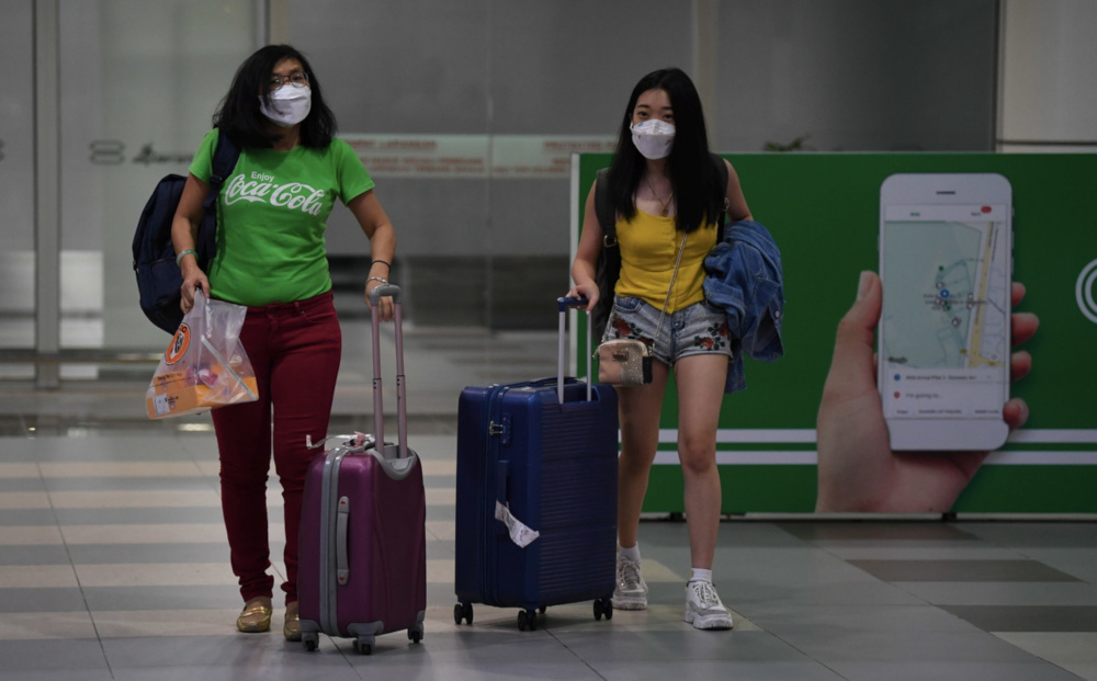 DO NOT USE THIS PIC!!!! Tourists wearing masks at the Kota Kinabalu International Airport January 24, 2020, following the novel coronavirus outbreak. u00e2u20acu201d Bernama pic  