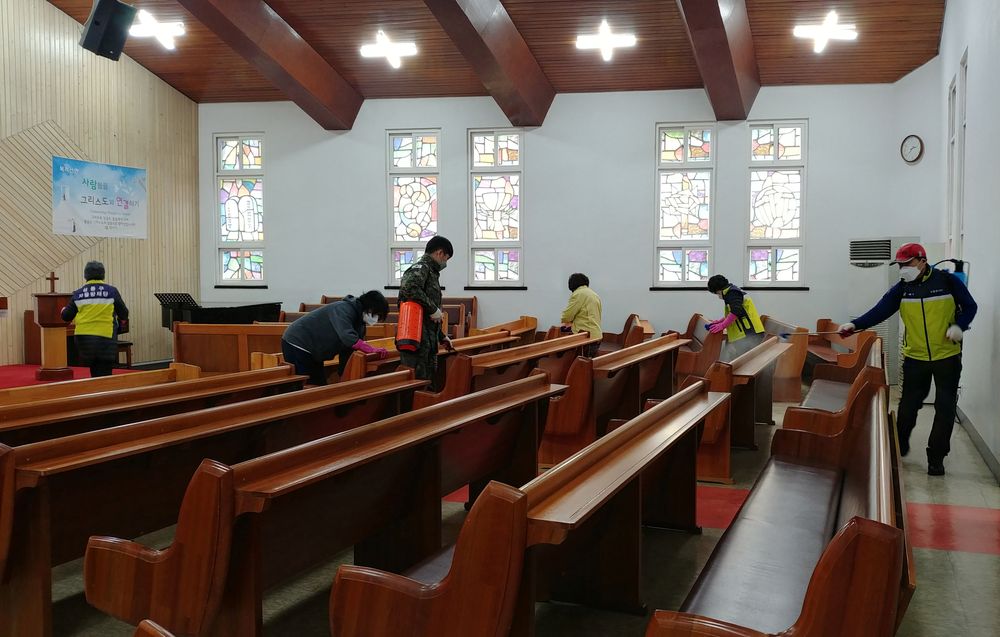 Residents sanitise at a church in Seoul, South Korea, February 22, 2020. u00e2u20acu201d Yonhap photo via Reuters