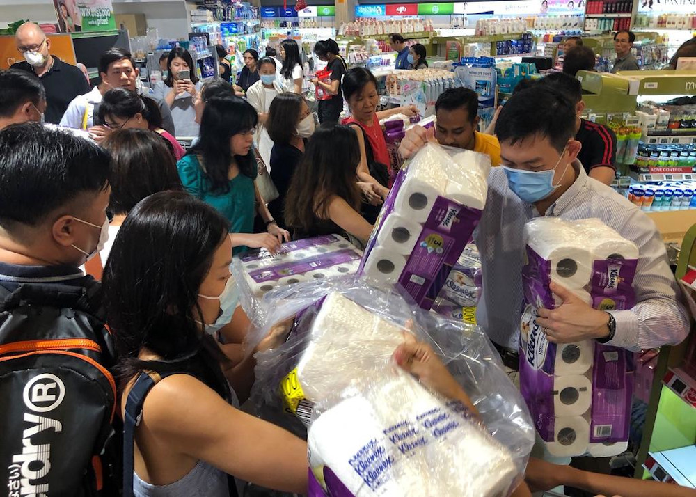 Shoppers at Fairprice Finest in Bukit Timah Plaza reaching out for toilet paper even before it got stocked in the shelves. u00e2u20acu201d TODAY picn
