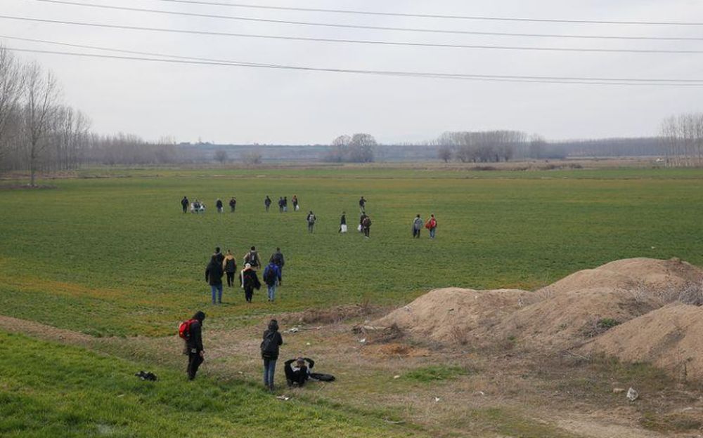 A group of migrants walk through the Turkish-Greek border in a village near the border city of Edirne, Turkey, February 28, 2020. u00e2u20acu201d Reuters pic