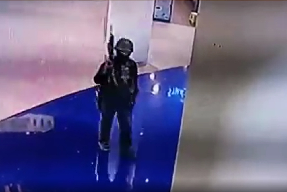 A video grab February 8, 2020 shows CCTV footage of Thai soldier Jakrapanth Thomma holding a gun as he walks through the Terminal 21 shopping mall in Nakhon Ratchasima. u00e2u20acu201d AFP pic/KMCOT Thai Public Company Limited