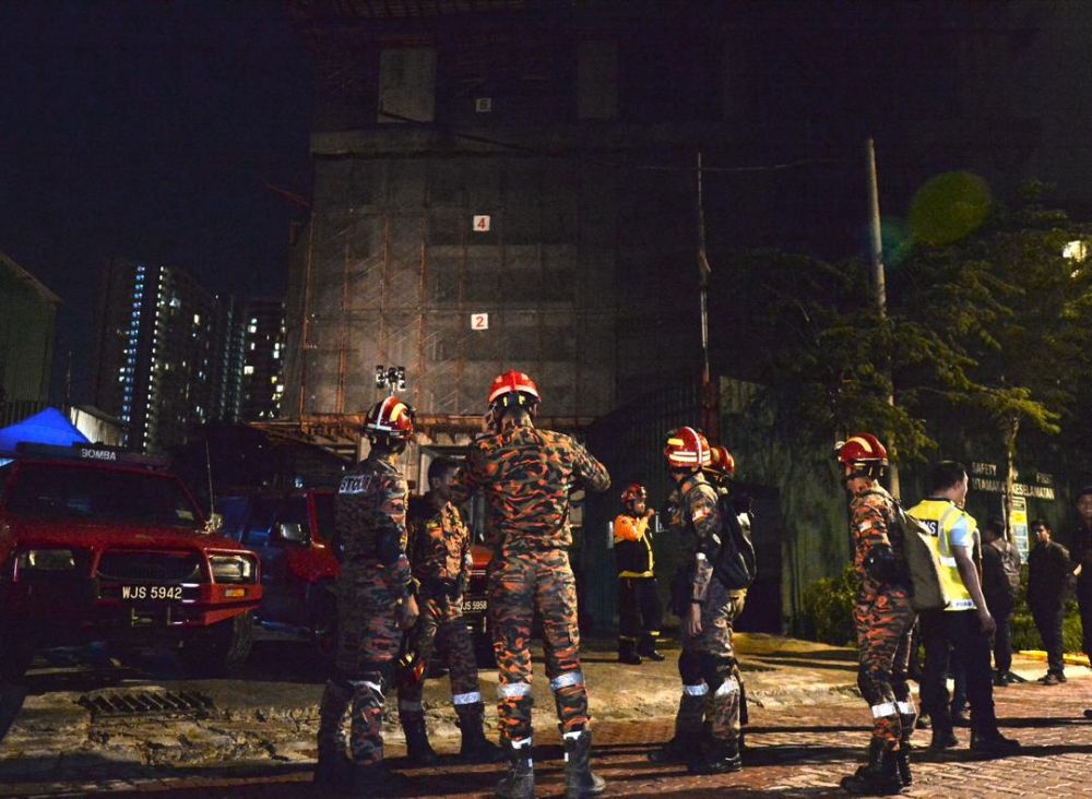Kuala Lumpur Fire and Rescue personnel are pictured at The Address condominium in Taman Desa, where a concrete slab collapsed from the buildingu00e2u20acu2122s sixth floor on February 14, 2020. 