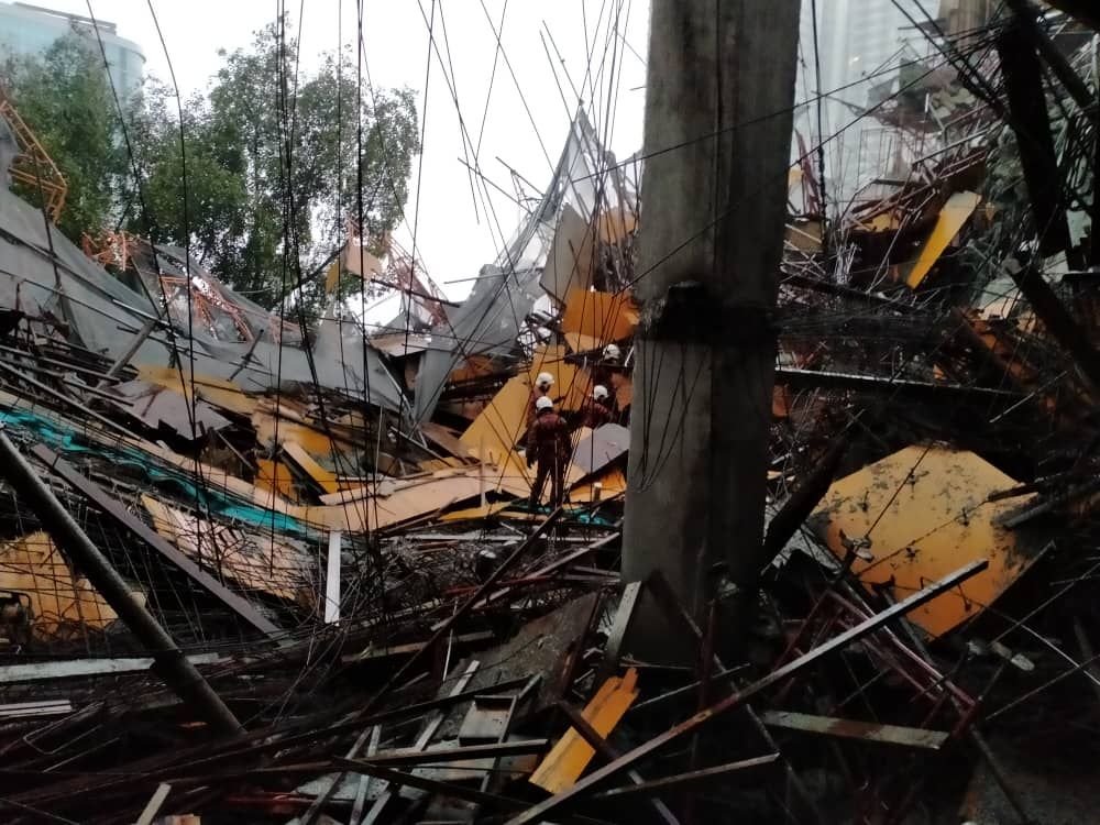 Kuala Lumpur Fire and Rescue personnel are pictured at The Address condominium in Taman Desa, where a concrete slab collapsed from the buildingu00e2u20acu2122s sixth floor on February 14, 2020. 