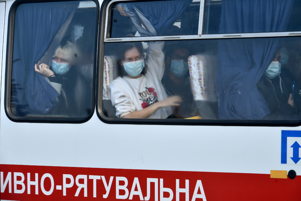 Evacuees from coronavirus-hit China look out from a bus as they leave an airport in Kharkiv, Ukraine February 20, 2020. u00e2u20acu201d AFP pic 