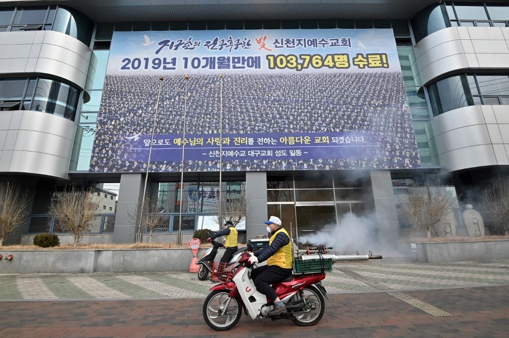 South Korean health officials spray disinfectant in front of the Daegu branch of the Shincheonji Church of Jesus in the south-eastern city of Daegu on February 21, 2020. u00e2u20acu201d AFP pic
