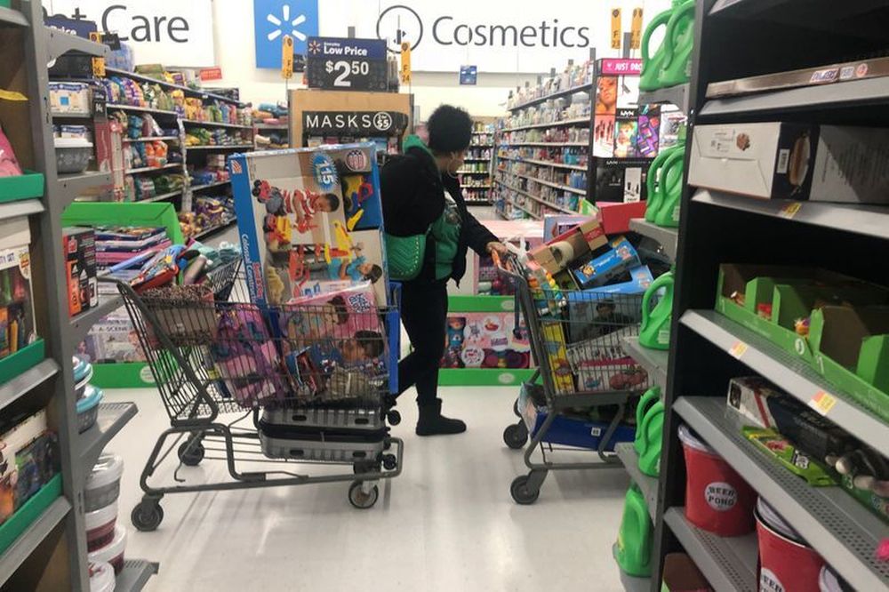 A woman pushes shopping carts during a sales event on Thanksgiving day at Walmart in Westbury, New York, November 28, 2019. u00e2u20acu201d Reuters pic