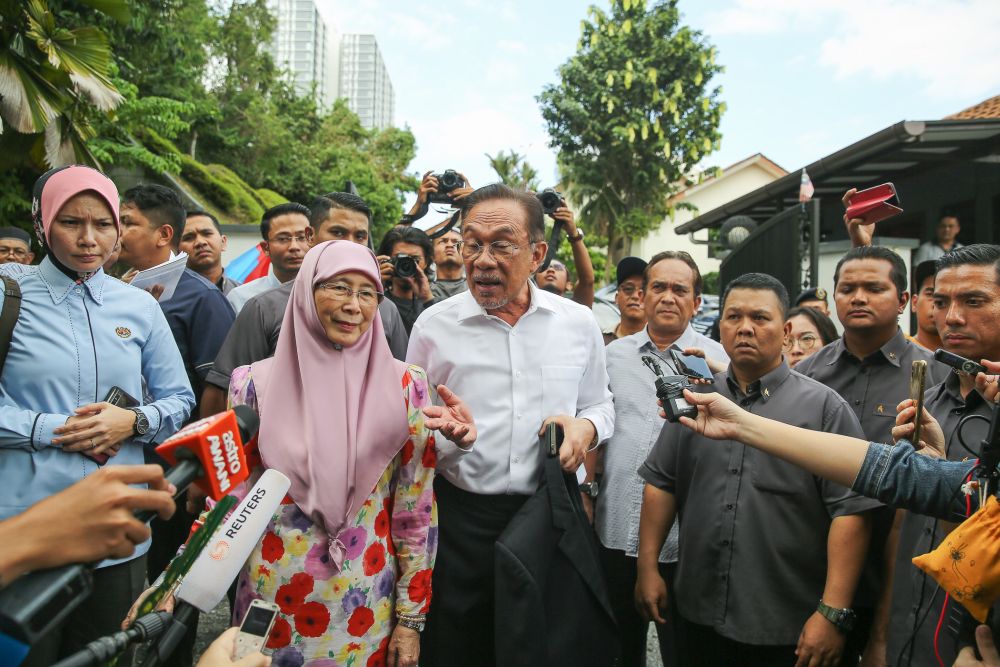 Datuk Seri Anwar Ibrahim speaks to reporters gathered outside his residence in Kuala Lumpur February 26, 2020. u00e2u20acu201d Picture by Yusof Mat Isa