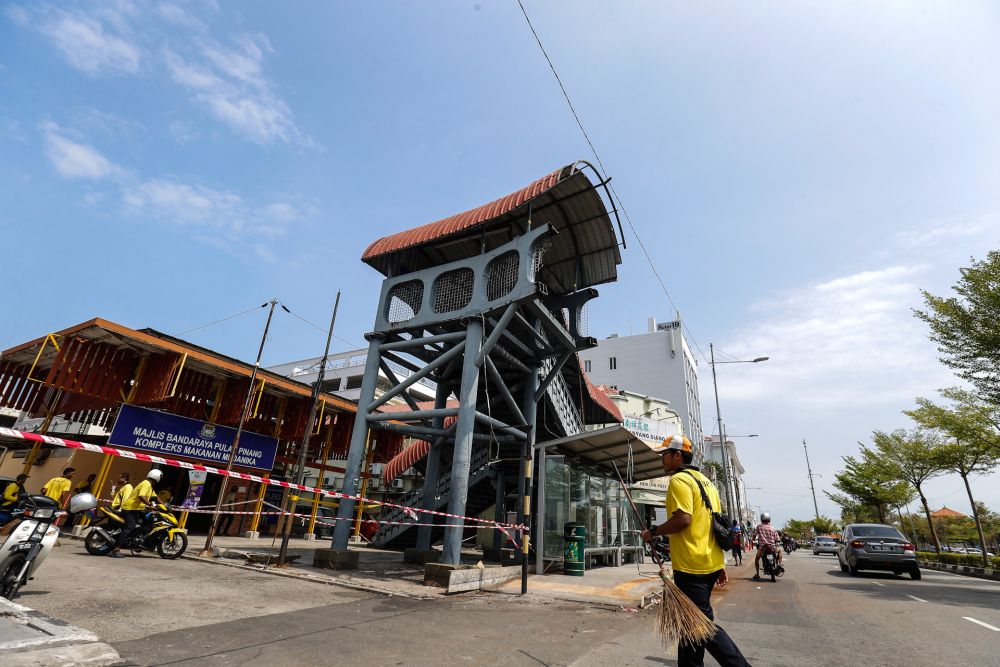 A general view of the damaged pedestrian bridge at Weld Quay February 6, 2020. — Picture by Sayuti Zainudin