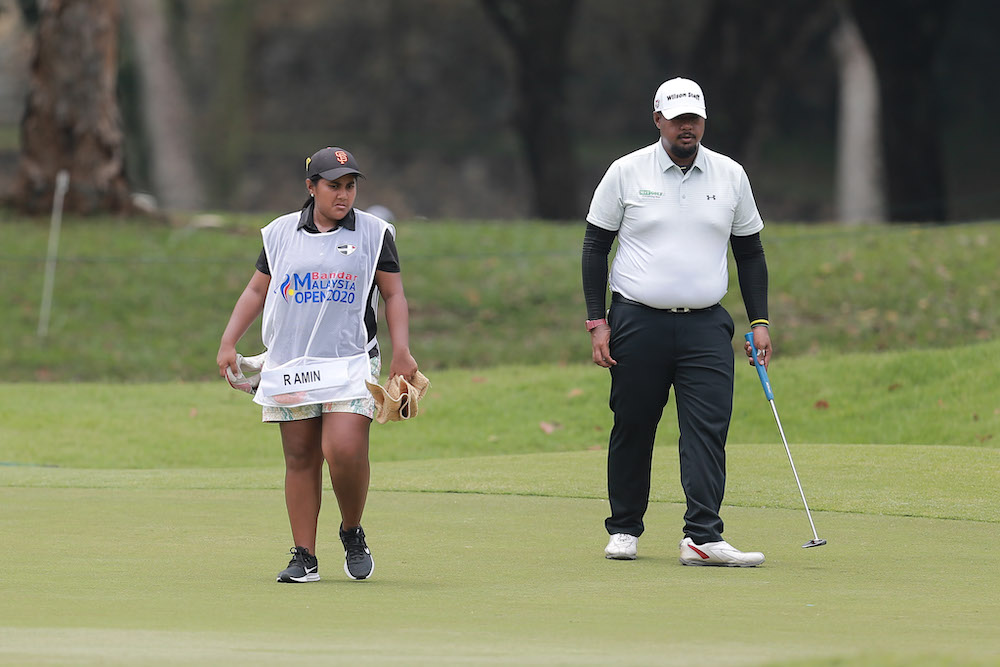 Fatin and Rizal, the budding brother sister duo out to make waves in the golfing world one step at a time. u00e2u20acu201d Picture by Ahmad Zamzahuri Abas