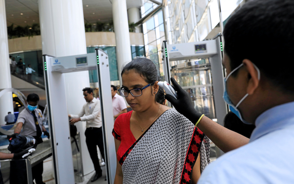 A woman is checked with a thermal scanner by officers at World Trade Center, after the first case with the coronavirus was detected, in Colombo, Sri Lanka March 12, 2020. u00e2u20acu201d Reuters pic
