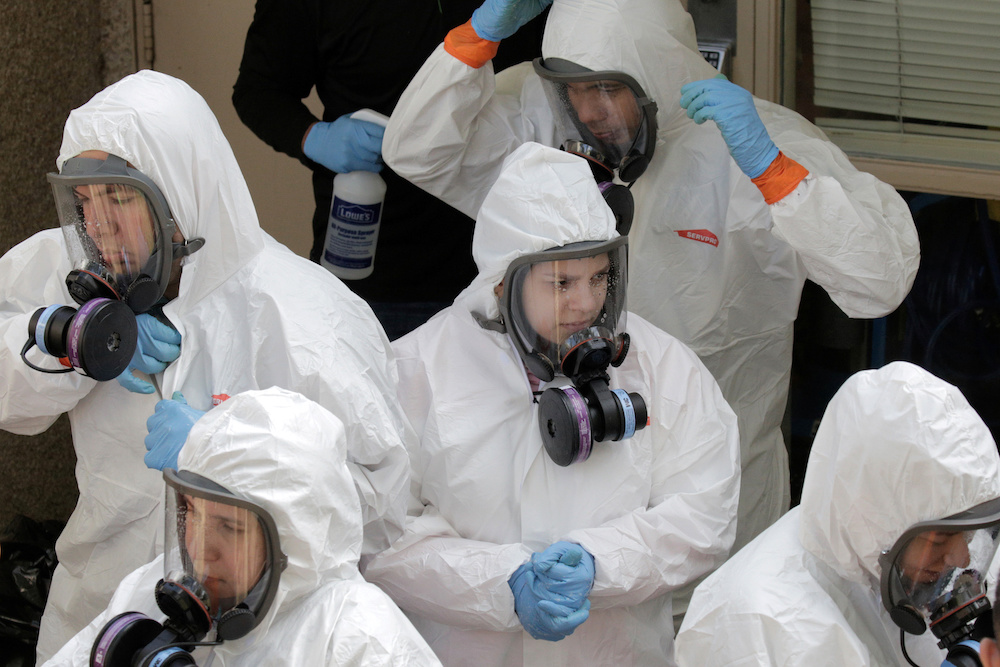 Members of a cleaning crew leave the Life Care Center of Kirkland, the Seattle-area nursing home at the epicenter of one of the biggest coronavirus outbreaks in the United States, in Kirkland, Washington March 12, 2020. u00e2u20acu201d Reuters pic