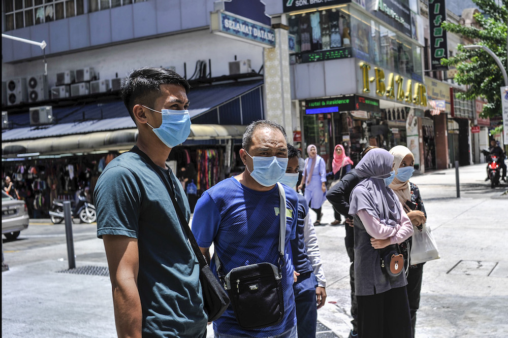 People are seen wearing face masks to protect themselves against the new coronavirus in Kuala Lumpur March 15, 2020. u00e2u20acu2022 Picture by Shafwan Zaidon