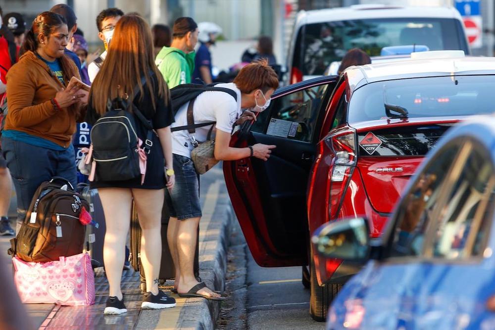 Commuters entering Singapore via the Woodlands Checkpoint today. After Malaysia announced a 14-day lockdown starting Wednesday, some Malaysian residents are preparing to stay in Singapore to continue working here. u00e2u20acu201d TODAY pic