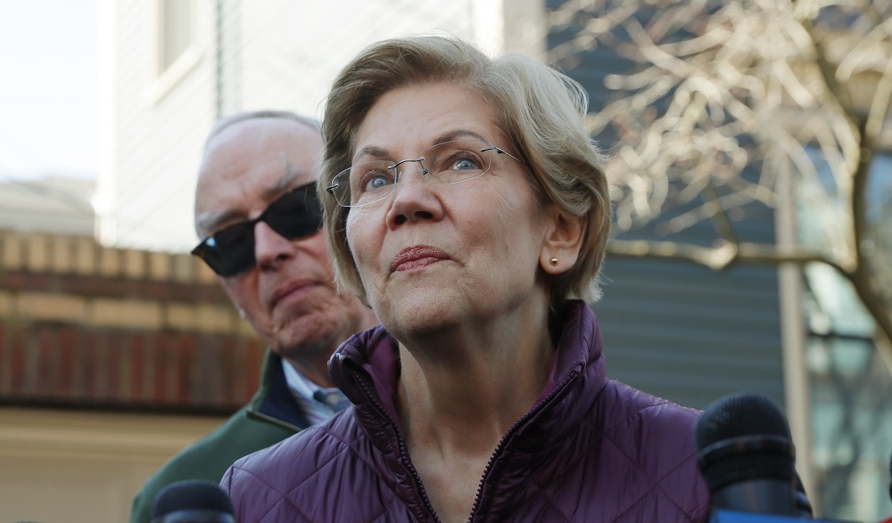 Democratic US presidential candidate Senator Elizabeth Warren talks to reporters outside her house about the end of her campaign for US president with her husband Bruce behind her, in Massachusetts March 5, 2020. u00e2u20acu201d Reuters pic