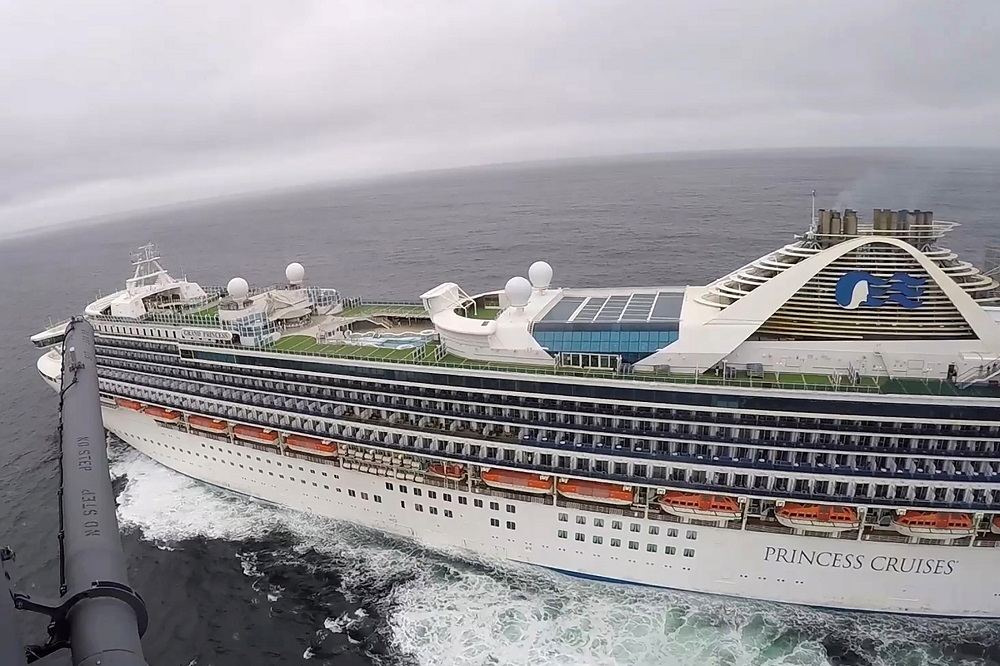 A California National Guard helicopter from the Moffett Federal Airfield based, 129th Rescue Wing deliver coronavirus test kits to the Grand Princess cruise ship off the coast of San Francisco March 5, 2020. u00e2u20acu201d Screen capture via California National Guar