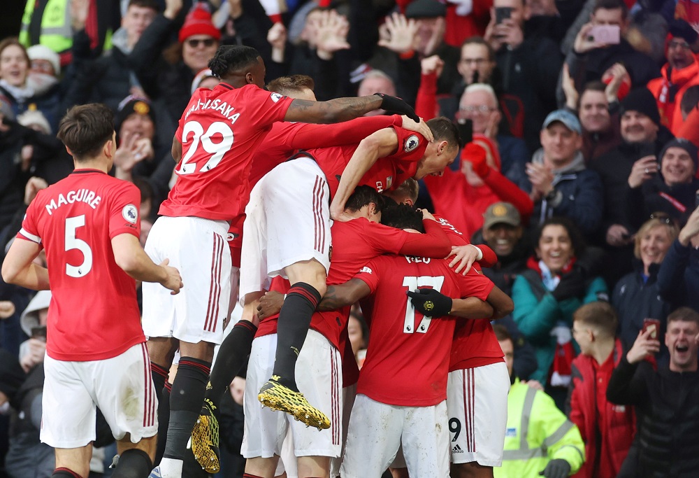 Manchester United's Anthony Martial celebrates scoring their first goal with teammates at Old Trafford in Manchester March 8, 2020. u00e2u20acu201d Action Images via Reuters