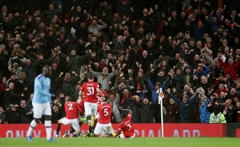 Manchester United's Scott McTominay celebrates scoring their second goal with teammates during the match against Manchester City at Old Trafford in Manchester March 8, 2020. u00e2u20acu201d Action Images via Reuters