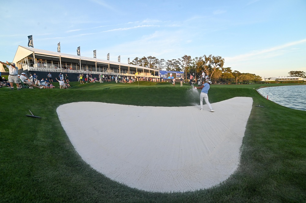 Tony Finau hits out of the sand on to the 18th green during the first round of the 2020 edition of The Players Championship golf tournament at TPC Sawgrass - Stadium Course in Florida March 12, 2020. u00e2u20acu201d Picture by Adam Hagy-USA TODAY Sports via Reuters