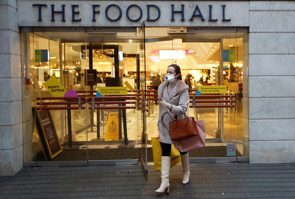 A customer wearing a face mask leaves the Selfridges Oxford street store prior to the company's temporary closure of its UK branches, as the spread of the coronavirus disease continues, in London March 18, 2020. u00e2u20acu201d Reuters pic