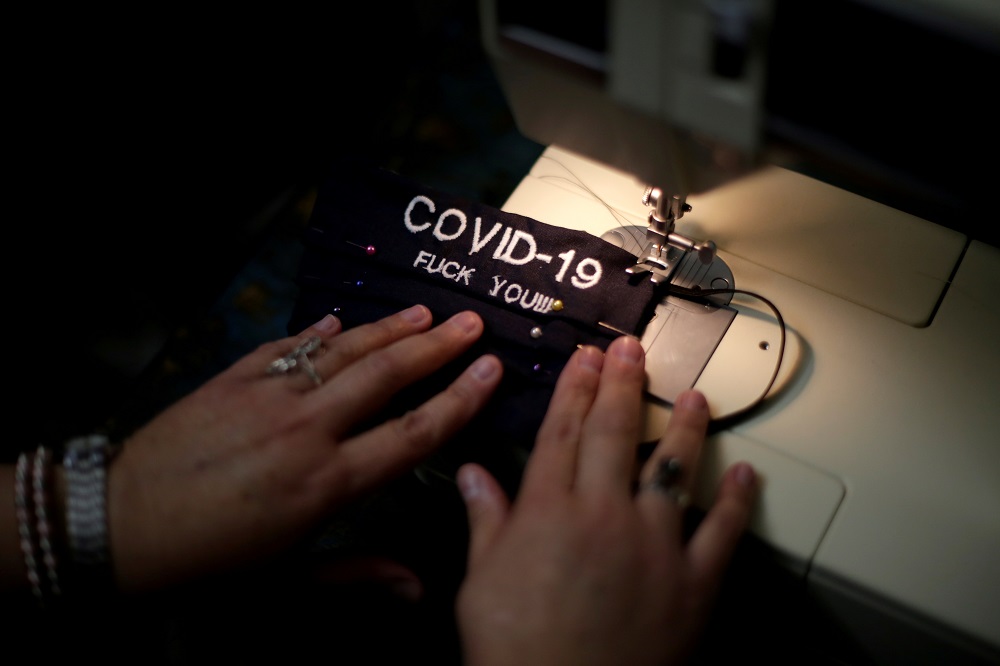 Erendira Guerrero sew a protective face mask at her sewing workshop, which she makes because of a lack of protective masks on the market due to demand for protection against coronavirus disease in Ciudad Juarez, Mexico March 16, 2020. u00e2u20acu201d Reuters pic