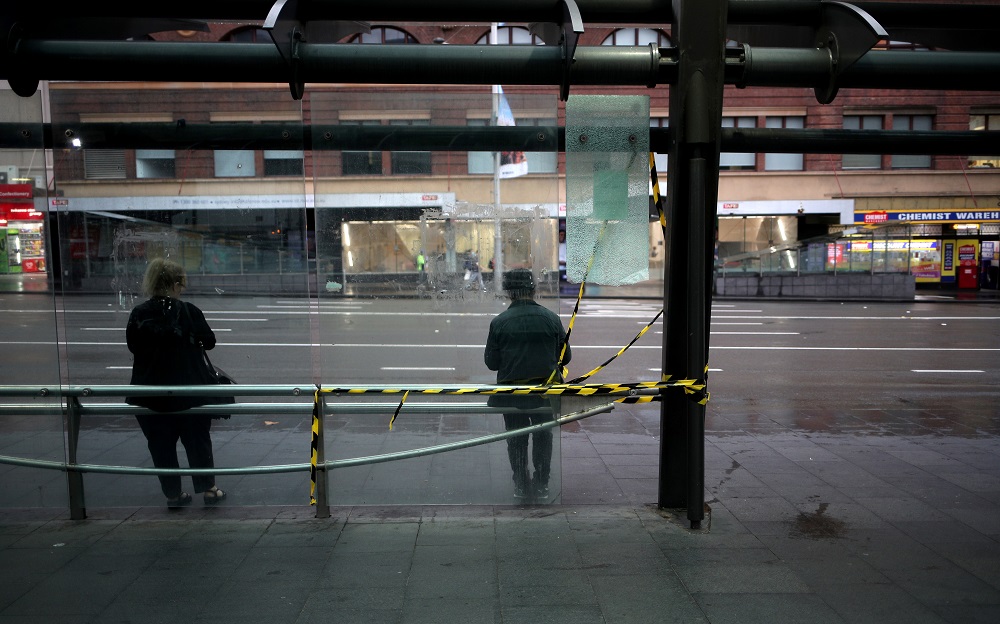 People follow a social distancing at a bus stop, as New South Wales begins shutting down non-essential businesses and moving toward harsh penalties to enforce self-isolation to avoid the spread of Covid-19 in Sydney March 25, 2020. u00e2u20acu201d Reuters pic