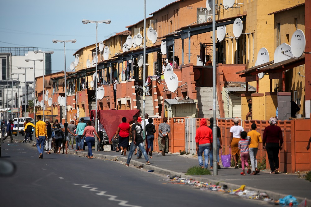 People walk down a street in Langa township as a 21-day lockdown aimed at limiting the spread of coronavirus disease takes effect in Cape Town March 27, 2020. u00e2u20acu201d Reuters pic
