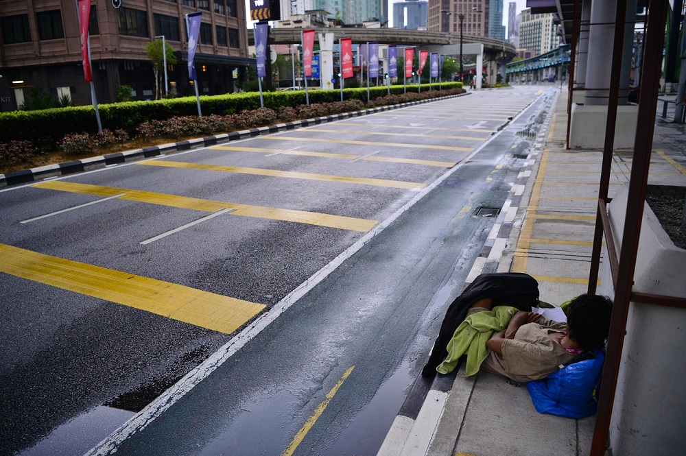 A homeless person is seen sleeping next to an empty street in Kuala Lumpur March 21, 2020. u00e2u20acu201d Bernama pic