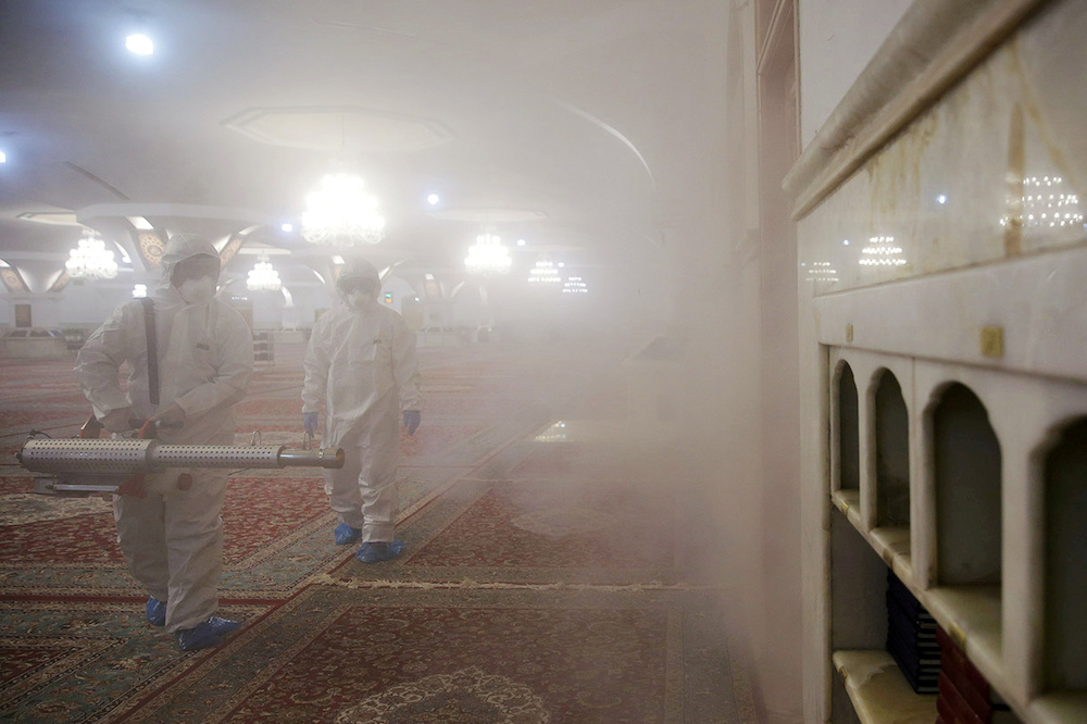 Members of the medical team spray disinfectant to sanitize indoor place of Imam Reza's holy shrine, following the coronavirus outbreak, in Mashhad, Iran February 27, 2020. u00e2u20acu201d Reuters pic