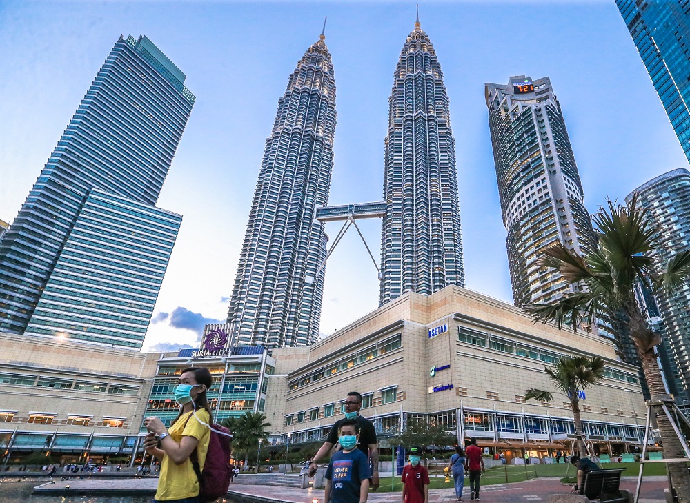 People are seen wearing face masks amid the Covid-19 outbreak, near KLCC in Kuala Lumpur March 16, 2020. u00e2u20acu201d Picture by Firdaus Latif 