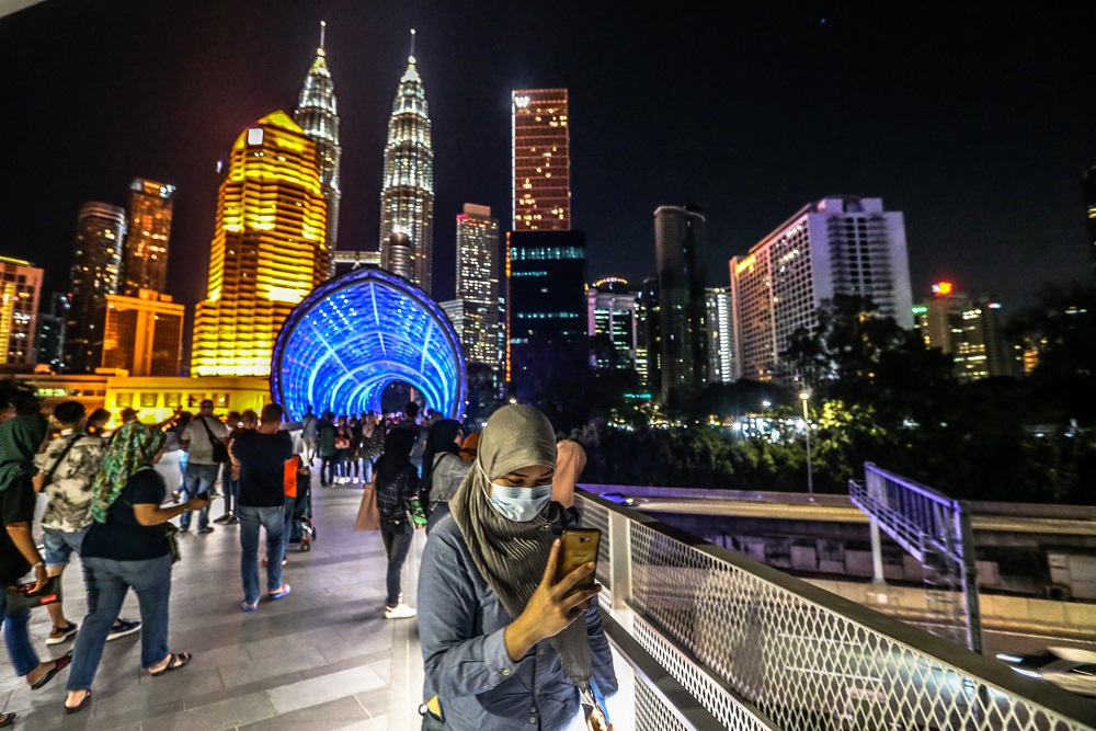 People are seen wearing face masks amid the Covid-19 outbreak, near KLCC in Kuala Lumpur March 16, 2020. u00e2u20acu201d Picture by Firdaus Latif 