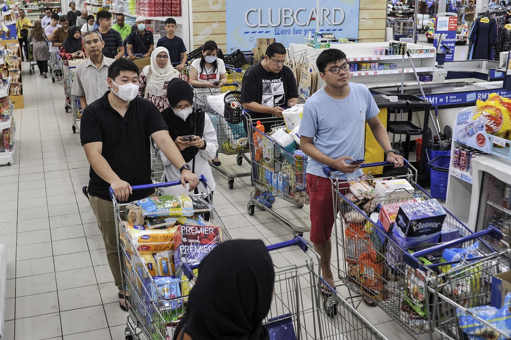 People are seen stocking up on food and other goods during the panic buying at a hypermarket in Kajang March 16, 2020. u00e2u20acu201d Picture by Shafwan Zaidonnn