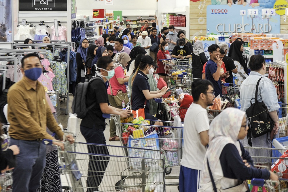 People are seen stocking up on food and other goods during the panic buying at a hypermarket in Kajang March 16, 2020. u00e2u20acu201d Picture by Shafwan Zaidonnn