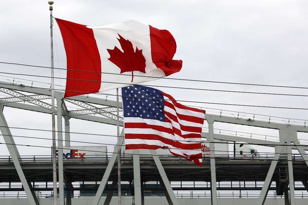 Vehicles cross the Blue Water Bridge over the St. Claire River to Port Huron, Michigan from Sarnia, Canada March 18, 2020. u00e2u20acu201d AFP pic