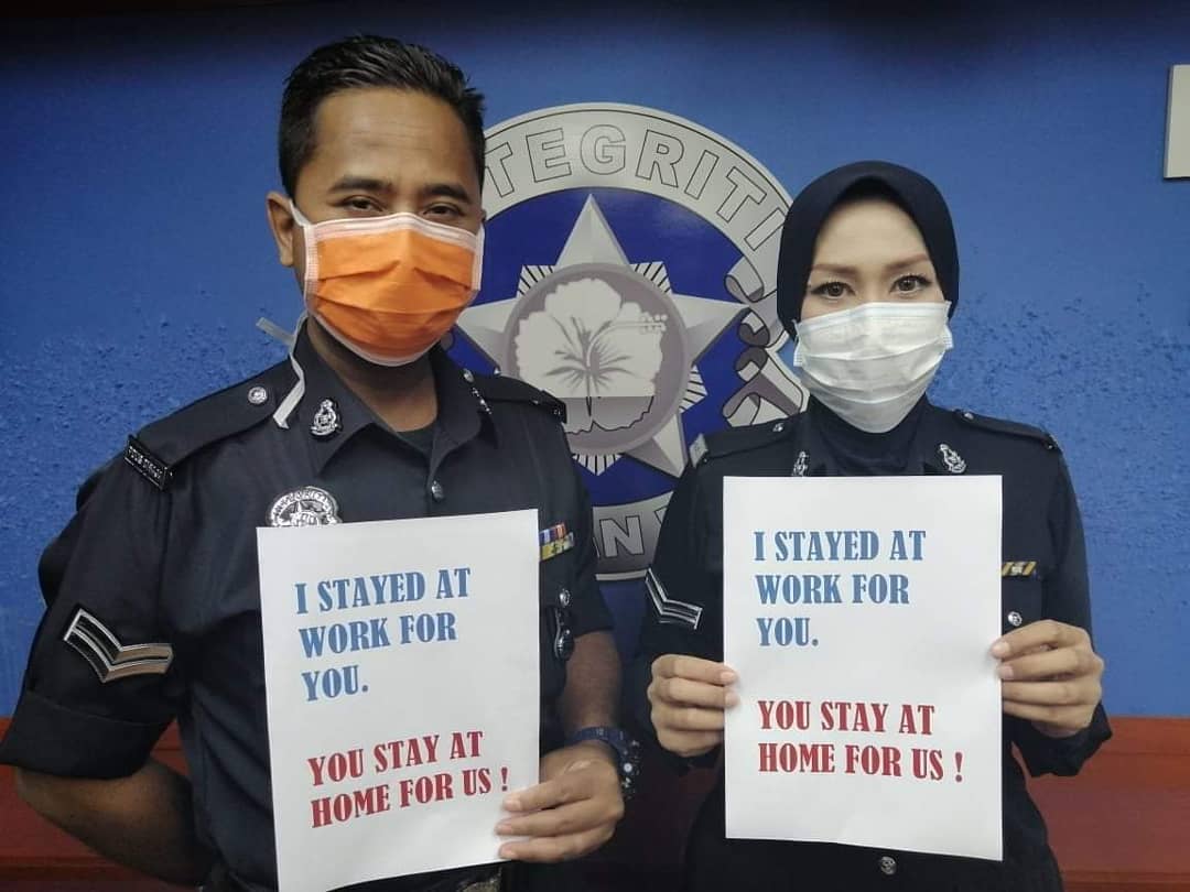 Royal Malaysia Police officers urge Malaysians to stay at home during the two-week nationwide movement control order. u00e2u20acu201d Picture via Facebook/fopdrm
