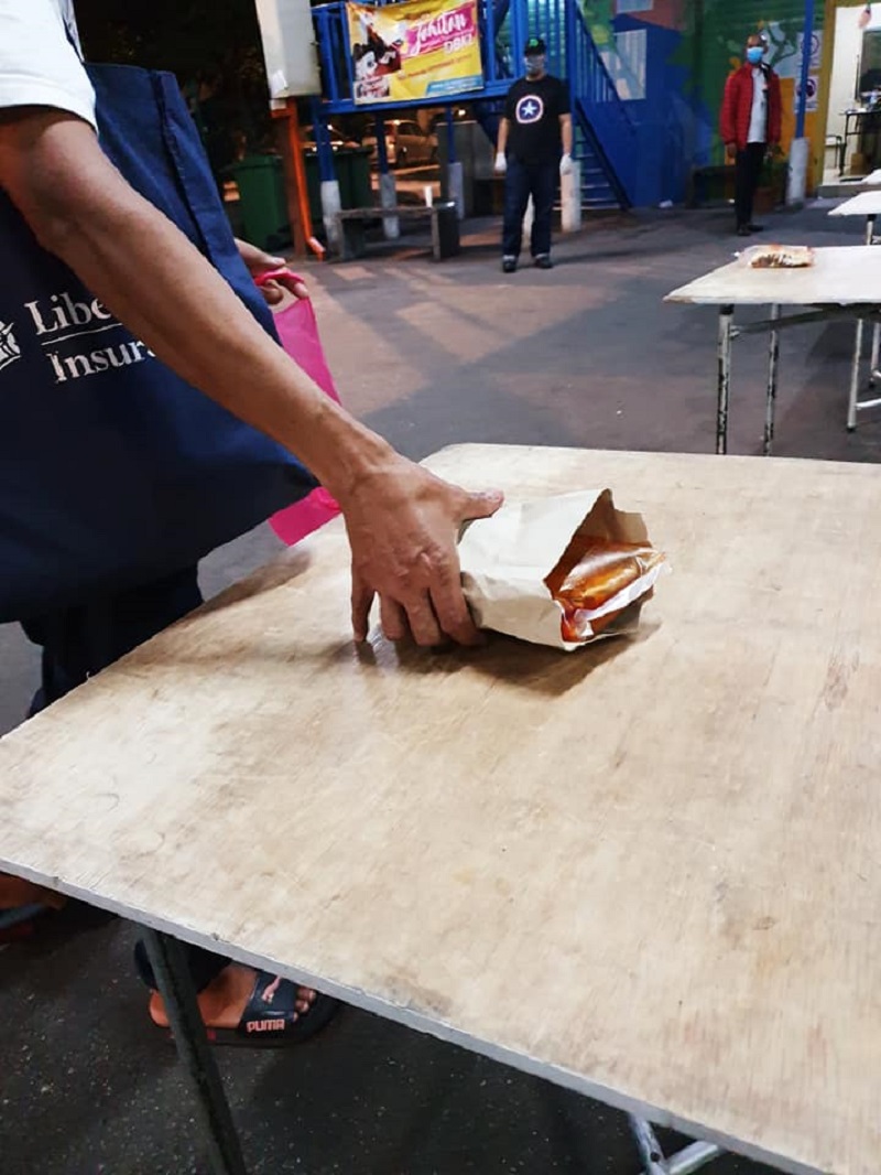 Pertiwi Soup Kitchen follows strict social distancing at its distribution centre and patrons are closely monitored. — Picture from Facebook/Pertiwi Soup Kitchen