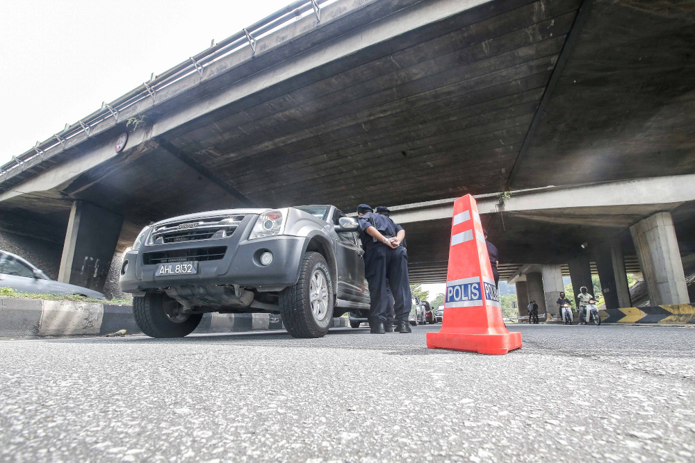 A police road block is seen at Jalan Kuala Kangsar following the movement control order to curb the spread of Covid-19 infection March 20, 2020. u00e2u20acu201d Picture by Farhan Najib