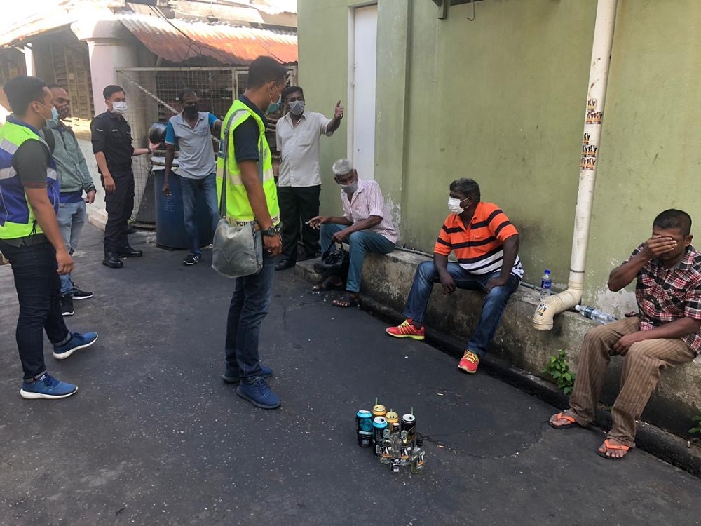 Four Malaysians and a foreigner are caught gathering at Jalan Burma in George Town during the movement control order period March 27, 2020. u00e2u20acu201d Picture courtesy of Royal Malaysia Police 