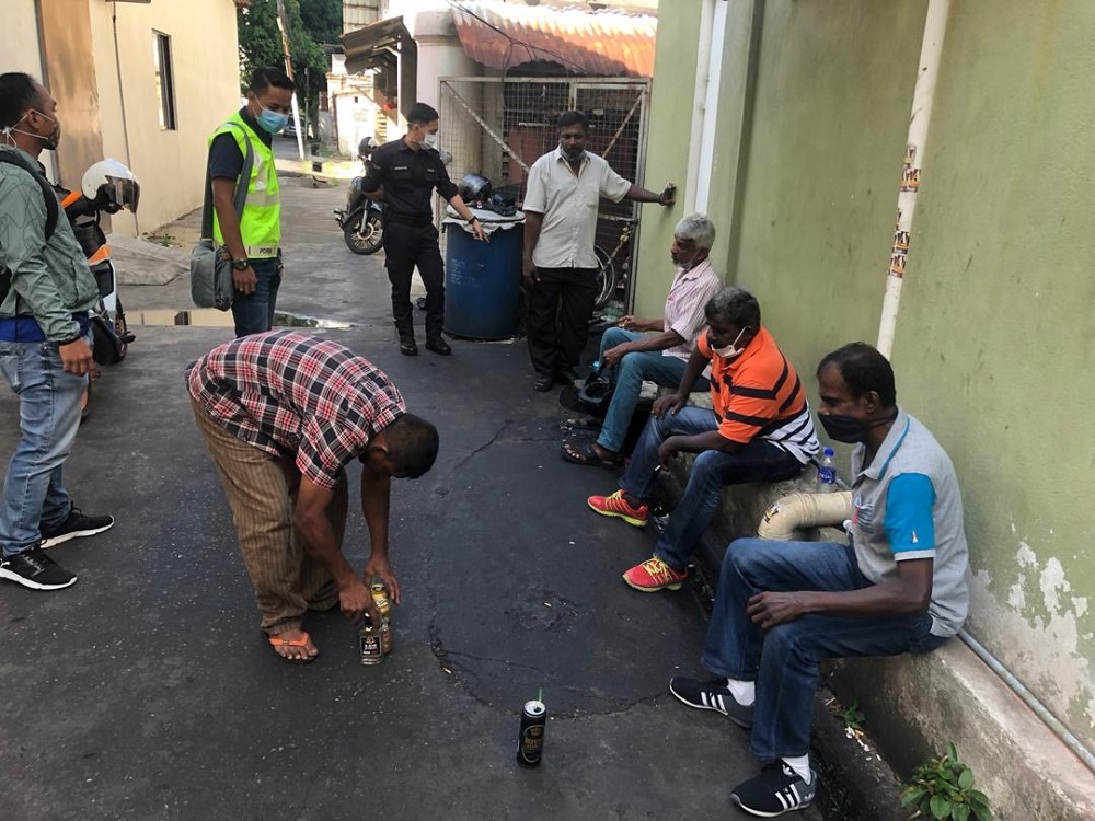 The men will be investigated under Section 7(1) Prevention of control of infectious diseases (Measures within the infected local areas) Regulations 2020 for violating the MCO. — Picture courtesy of Royal Malaysia Police 