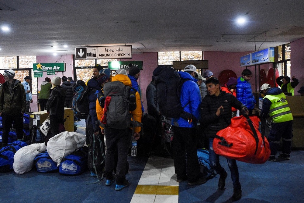 Trekkers arrive at the Tenzing-Hillary Airport in Lukla, some 140 kilometres northeast of Kathmandu, following travel restrictions in the country as a preventive measure against the COVID-19 March 23, 2020. u00e2u20acu201d AFP pic