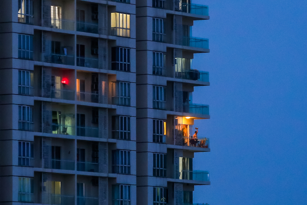 A man exercises on the balcony as people stay in their homes to prevent the spread of coronavirus during the movement control order (MCO) in Kuala Lumpur March 29, 2020. u00e2u20acu201d Picture by Firdaus Latif
