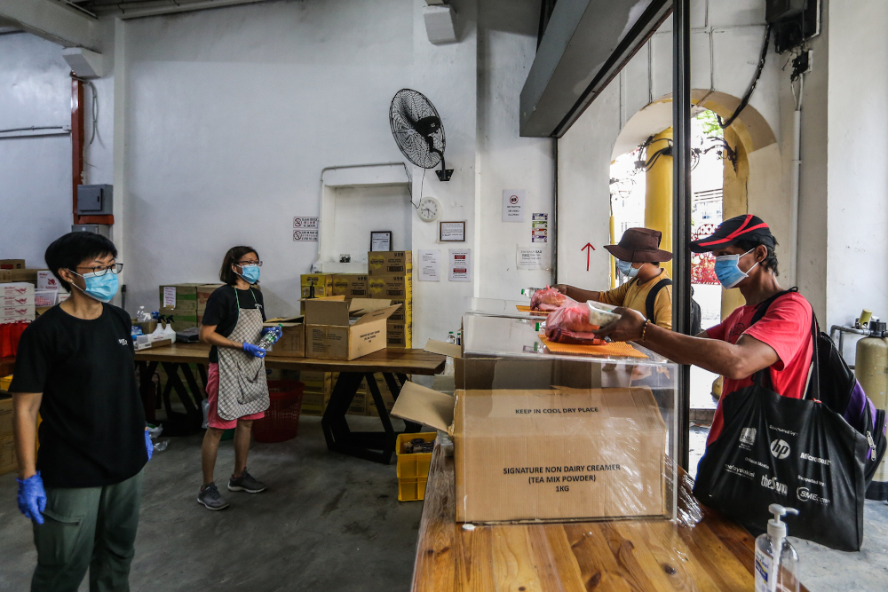 Last day of food distribution for Pit Stop Cafe in Kuala Lumpur March 30, 2020. u00e2u20acu201d Picture by Firdaus Latif