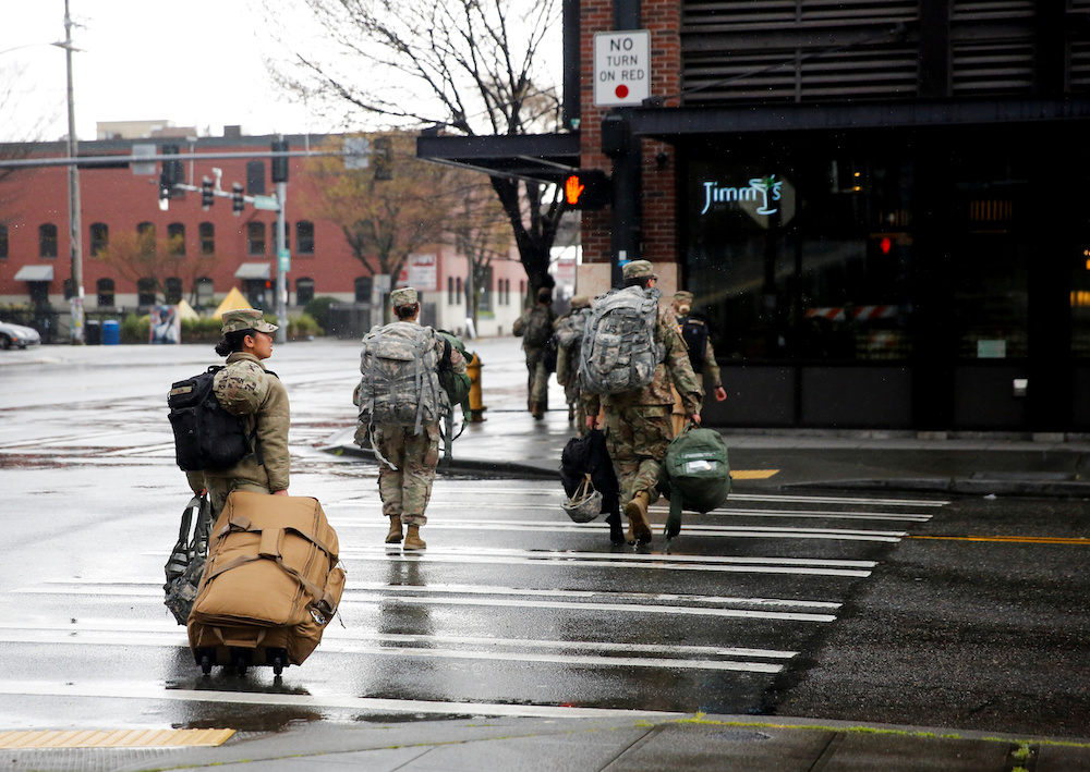 Soldiers from the 627th Army Hospital walk across the street after working at CenturyLink Field Event Centre in Seattle March 30, 2020. u00e2u20acu201d Reuters picnn