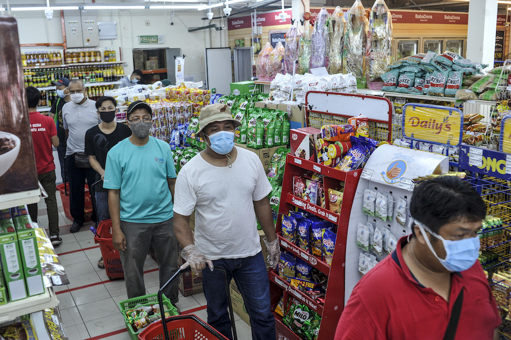 Baba Dona Super Mart Lembah Pantai taking precautionary measures to curb the spread of Covid-19 infection by implementing social distancing, crowd control measures, March 22, 2020. u00e2u20acu201d Picture by Shafwan Zaidon