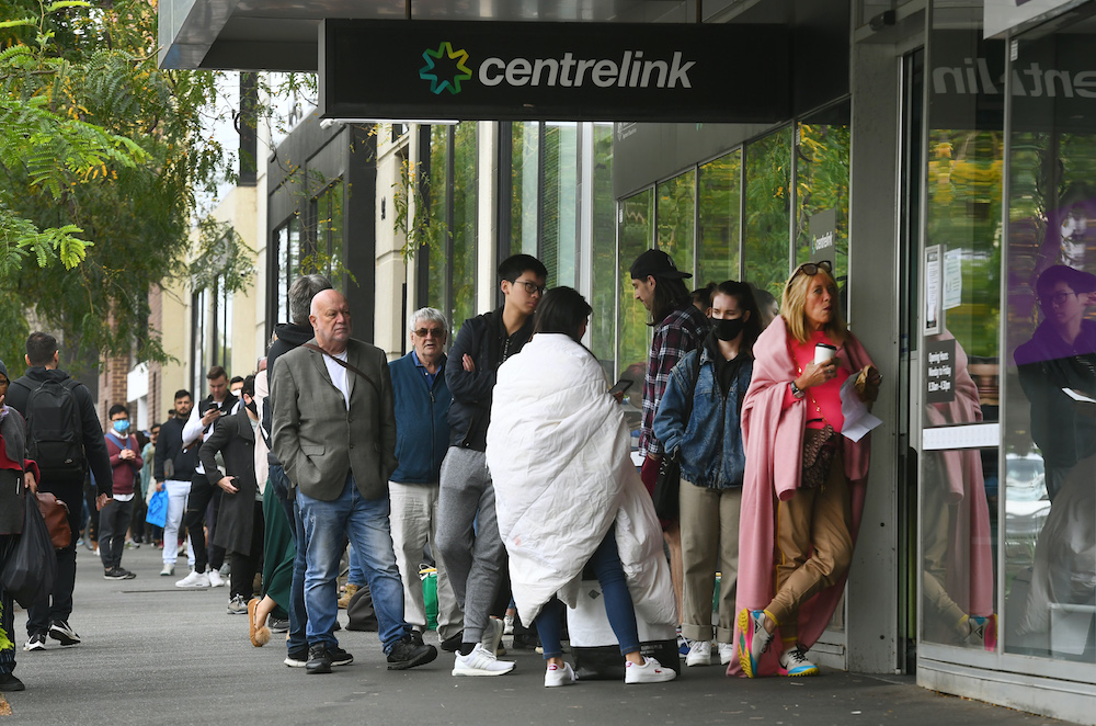 Hundreds of people queue outside an Australian government welfare centre, Centrelink, in Melbourne on March 23, 2020, as jobless Australians flooded unemployment offices around the country. u00e2u20acu201d AFP pic