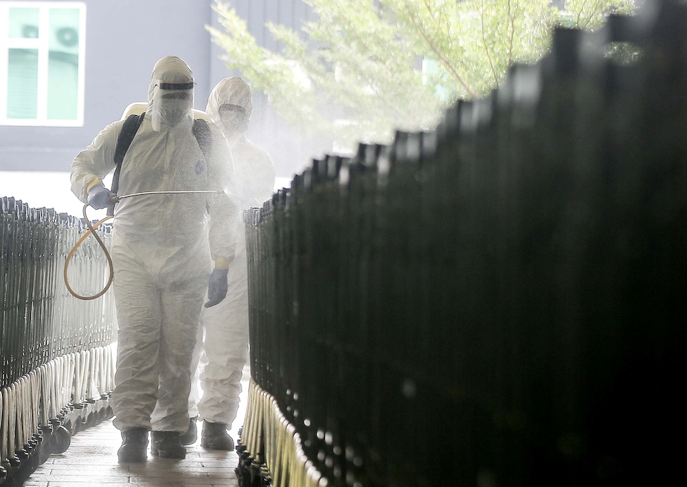 Personnel from the fire department carry out disinfection operations at Mydin Mall in Meru March 30, 2020. u00e2u20acu201d Picture by Farhan Najib