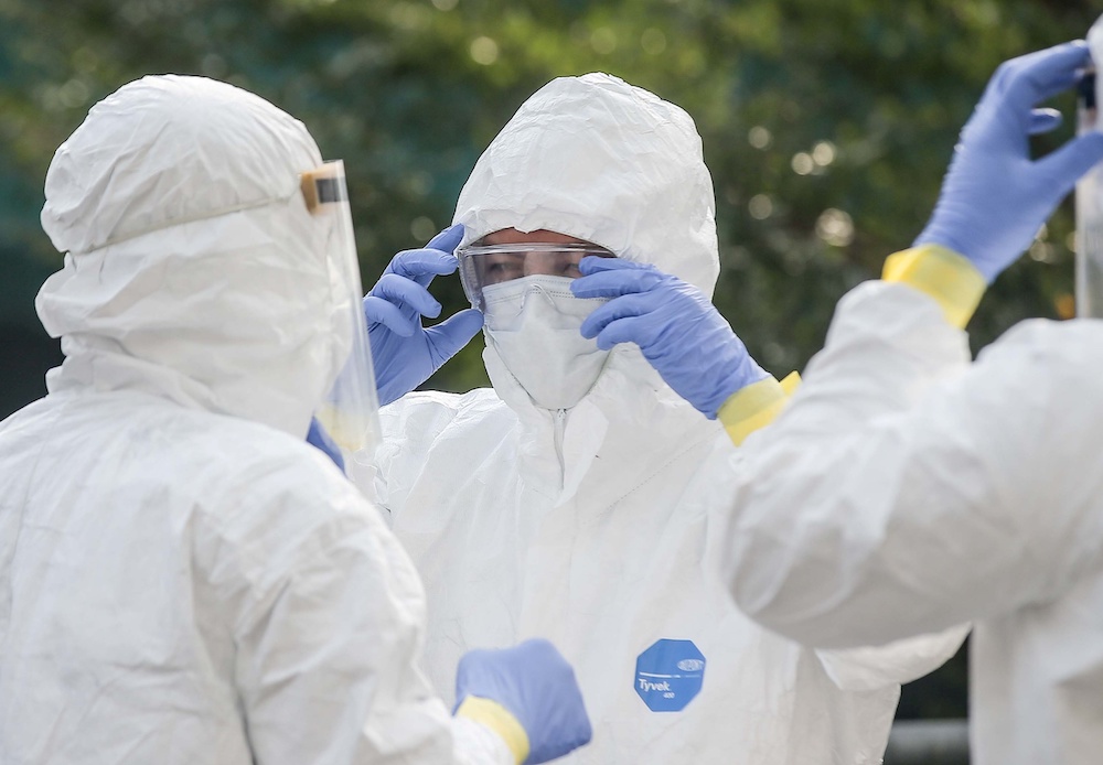 Personnel from the fire department carry out disinfection operations at Mydin Mall in Meru March 30, 2020. u00e2u20acu201d Picture by Farhan Najib