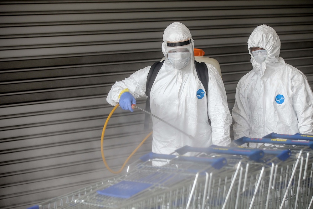 Personnel from the fire department carry out disinfection operations at Mydin Mall in Meru March 30, 2020. u00e2u20acu201d Picture by Farhan Najib