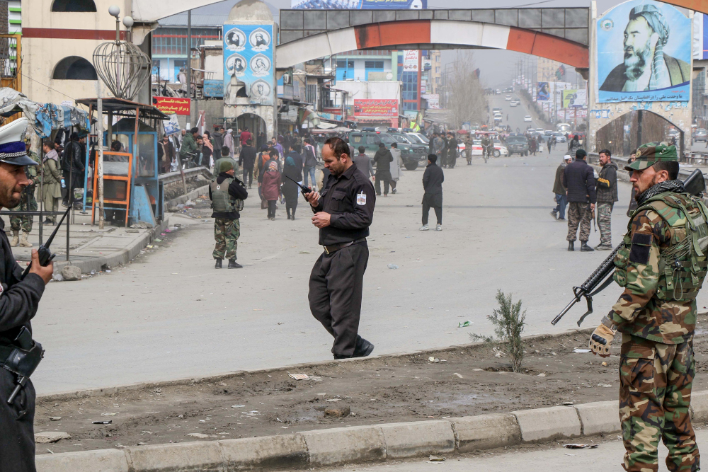 Afghan security forces personnel stand guard on a road near the site of a gun attack in Kabul March 6, 2020. u00e2u20acu201d AFP pic 