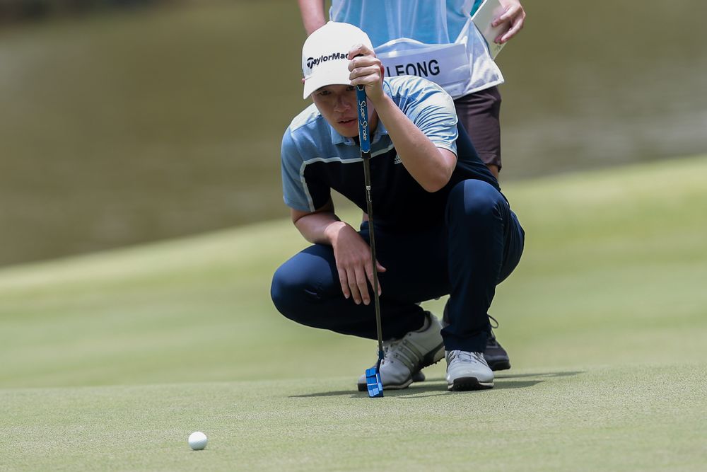 Ben Leong a picture of concentration as he lines up a putt during Round 3 of the Bandar Malaysia Open.